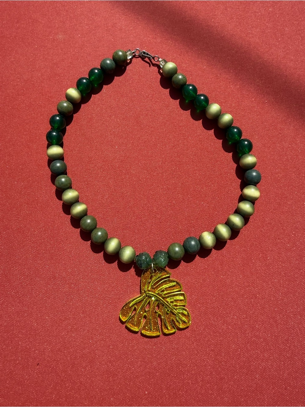 Green Beaded Necklace with Gold Leaf Pendant - Women's Jewelry